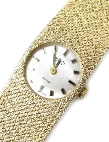 A Rotary lady's wristwatch, of solid bark design strap, with small circular watch head on silvered dial, marked to clasp 375, maker DS & S, 44.3g all in.