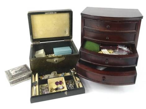 A quantity of costume jewellery, to include silver dress rings, gold plated necklaces, silver napkin ring, faux pearl necklaces, wristwatch heads, beaded necklaces etc., contained in two jewellery boxes. (2)