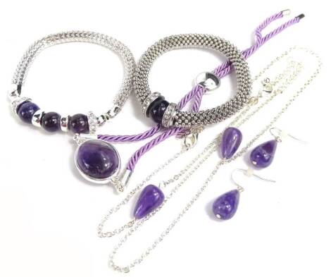 Various semi precious stone set jewellery, to include a necklace and earring set, bracelet on string expanding strap and two further bracelets, all set with purple stone.