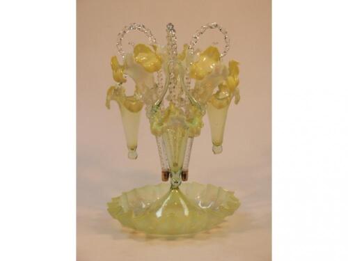 A Victorian Vaseline glass epergne with three trumpet vases and three hanging baskets