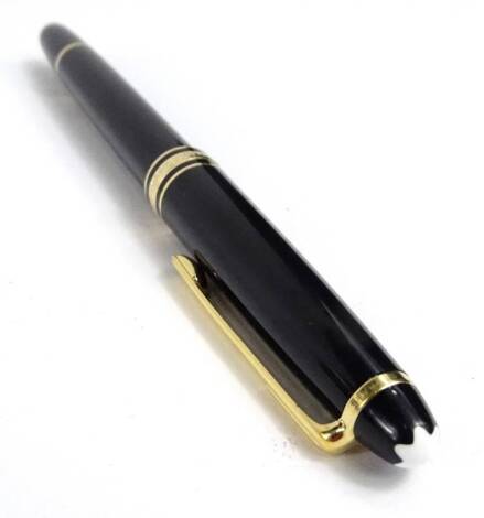 A Mont Blanc black and gold coloured metal ballpoint pen, no case etc.