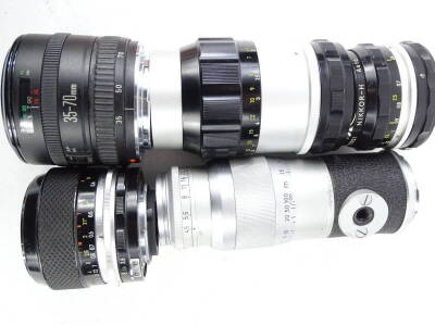 A collection of camera lens, to include a Nikon 135mm, a Nikon 55mm, a Canon 70mm, and a 135mm lens. - 3