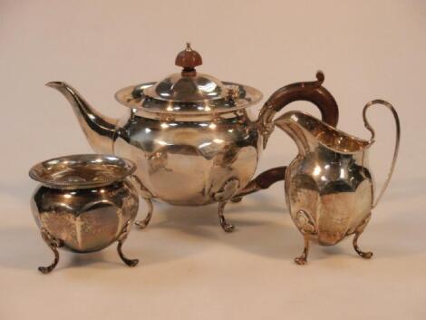 A George V silver three piece tea service by Edward & Sons