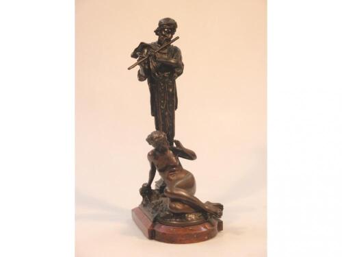 After Ferdinand Lepeke. A bronze and spelter figure group of a female nude