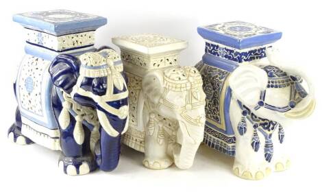 Three similar oriental elephant shaped garden seats, to include two with blue glaze, one mainly cream, the largest 44cm H.