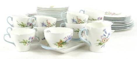 A Shelley Wild flowers pattern part tea and dinner service, to include oval meat dish, square bowl and a sandwich plate etc.