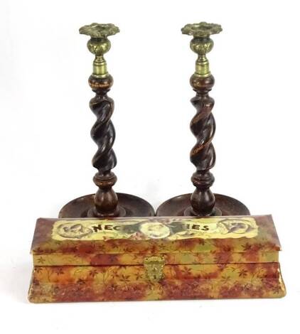 A late 19th/early 20thC box and cover, with printed decoration titled 'Neckties' in gold and brown, 31cm W, and a pair of spirally turned oak and brass candlesticks.