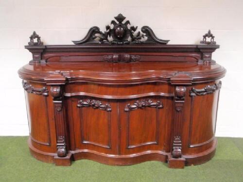 A Victorian figured mahogany sideboard