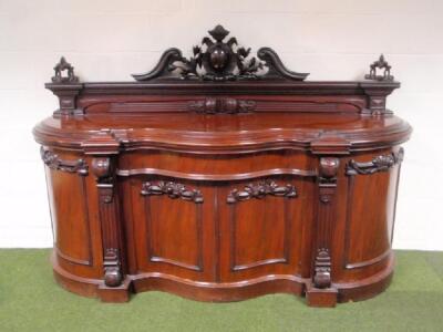 A Victorian figured mahogany sideboard