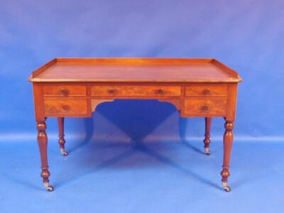 A 19thC figured mahogany kneehole desk