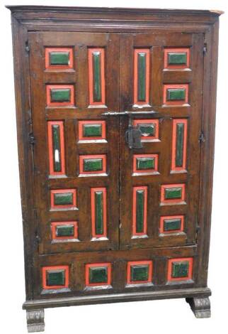 An 18thC Continental walnut cupboard, with two later painted panelled doors, enclosing a velvet lined interior on shaped feet, 163cm H, 105cm W.