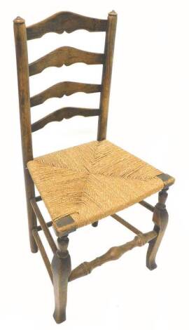 An early 19thC country made ladder back side chair, with a later rushed seat, on cabriole legs with turned stretchers.