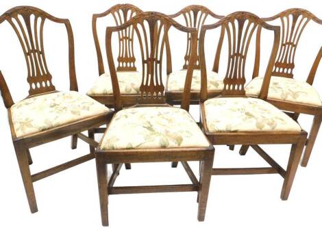 A set of six George III mahogany dining chairs, each with a pierced splat carved with leaves, flowerhead and wheat ears, with a drop in seat on square tapering legs with H stretcher.