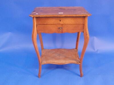 An early 20th century French walnut quarter veneered work table