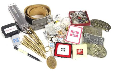 A quantity of Ruston Bucyrus and Bucyrus advertising souvenirs and memorabilia, to include belt buckle, tape measure, uncirculated key rings etc.