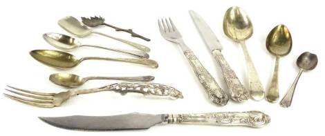 A collection of small silver white metal and silver plated cutlery, to include a Continental fork with elaborate pierced handle.