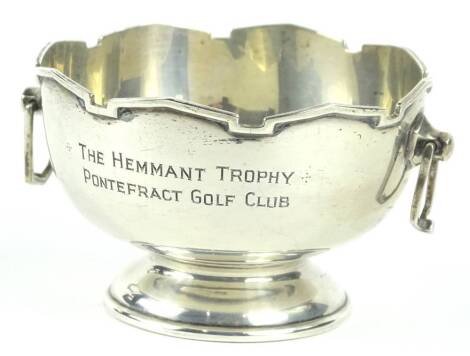 A small George V silver two handled trophy, in the form of a rose bowl or monteith, with a moulded edge, angular handles and a tapering foot, engraved 'The Hemmant Trophy Pontefract Golf Club awarded to an M A Wilson 1933', Sheffield 1932, 2½oz.