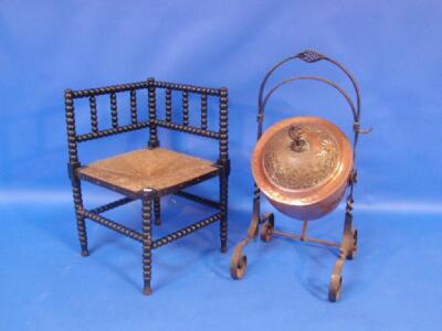 An Arts and Crafts copper coal scuttle and a Victorian ebonised corner chair