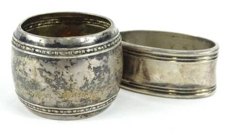 A Danish oval napkin ring, stamped 830, and a further napkin ring, 1½oz.