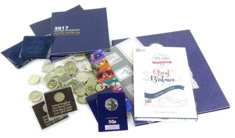 A quantity of commemorative coins, to include 50 pences, a crown, the A-Z of Great Britain issued by the Royal Mint, Beatrix Potter etc.