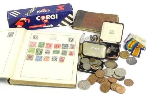 Miscellaneous items, to include a 19thC book with numerical musical type score, dated 1879, a Strand stamp album, Corgi car transporter, coins etc.