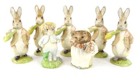 Seven John Beswick Beatrix Potter figures, to include Tomkin in the Rockery, Mrs Tiggy Winkle in gold, Benjamin ate a Lettuce Leaf x5. (7)