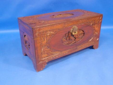 A carved camphor wood blanket box