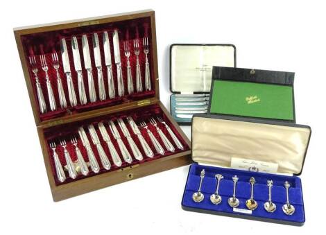 A collection of cutlery, to include a set of silver plated dessert knives and forks, with engraved blades in a fitted case, silver Jubilee commemorative spoons etc.