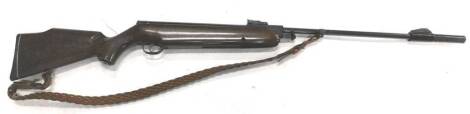 A Webley Omega air rifle, with leather strap and silencer, 121cm L.