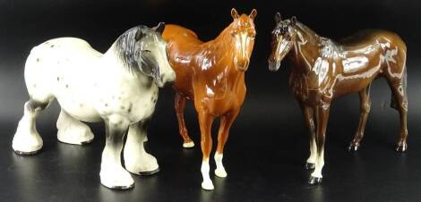 Three ceramic horses, to include a large brown Beswick horse, a similar paler coloured horse and an unmarked grey dappled shire 34cm W.