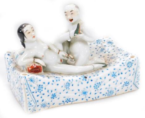 A Chinese porcelain erotic figure group