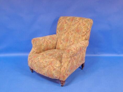 A late Victorian armchair upholstered in floral tapestry