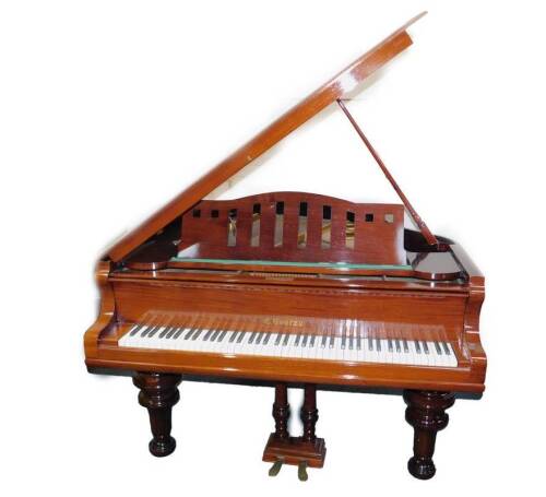 A mahogany cased baby grand piano by C Goetze, patent no 90034, iron framed and cross strung, no 1090, raised on turned legs, 100cm H, 146cm W, 159cm D.