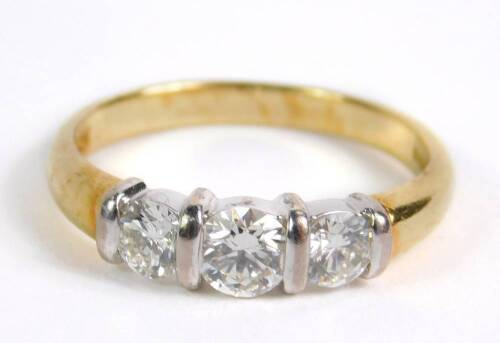An 18ct gold and diamond three stone ring, approx 0.9ct, size N, 3.7g.