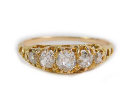 A Victorian diamond five stone ring, set with rose cut diamonds, in yellow metal, approx 0.7cts, size P, 2.4g.
