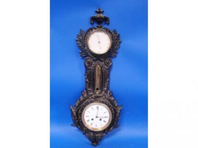 An early 20thC cast and bronzed clock barometer marked J J Wainwright & Co