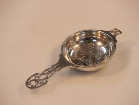 A George VI silver tea strainer