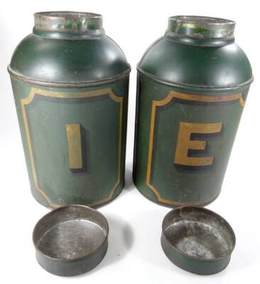 A pair of 19thC toleware tea tins, each in green tin, of shouldered circular form, one initialled E the other I, with gilt decoration and removable lids, 48cm H. (2) - 2