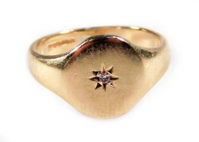 A 9ct gold signet ring, set with central tiny diamond, in illusion star setting, 3.4g all in.