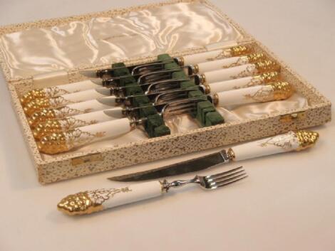 A set of six Royal Crown Derby fruit knives and forks