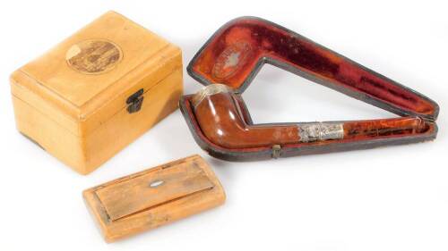 An early 20thC sycamore Mauchline ware casket, of rounded rectangular outline set with Penrith scene, with lift out compartment, 6cm high, 10cm wide, 7cm deep, a cased meerschaum pipe with silver mounts and a polished snuff box with mother of pearl inlay