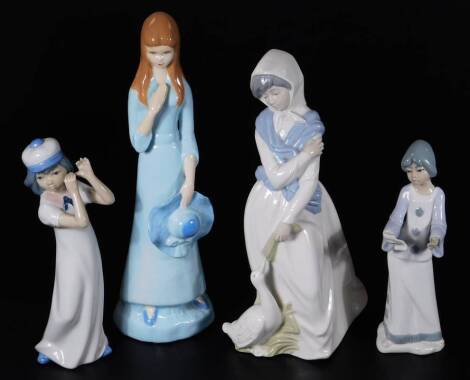 Various 20thC Spanish Casades figures, to include girl with flowing robes feeding goose, 30cm H, similar figures etc. (4).