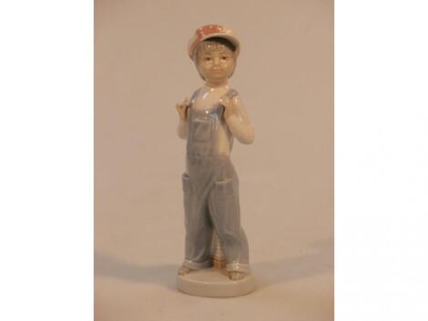 A Lladro figure of a young boy