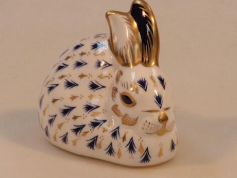 A Royal Crown Derby bone china paper weight modelled as a rabbit