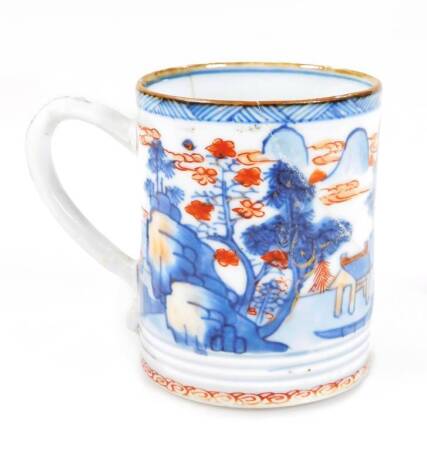 A Chinese Imari porcelain tankard, of cylindrical form, with ear shaped handle, heavily decorated with buildings, cliffs and a seascape, in orange and blue, on a circular foot, 7cm H. (AF) See Christies 22nd June 1989 Monaco lot 66 for a similar item.
