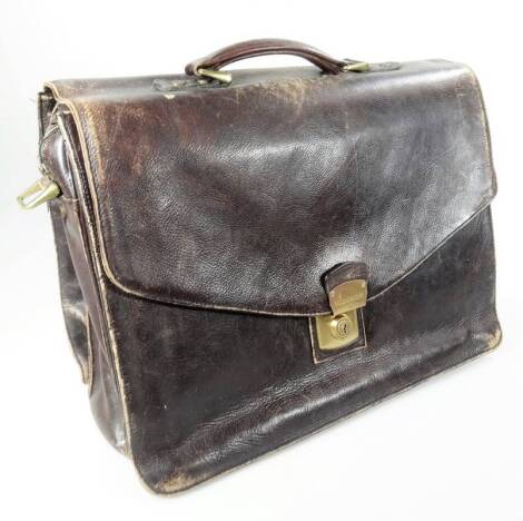 A 20thC leather satchel, with articulated front and metal lock, marked Cheney Hidesign, with part fitted interior, 39cm H.