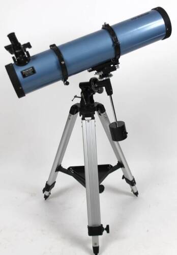 A Skywatcher telescope, in blue, on a tripod stand, 85cm W, D=130MM F=900MM.
