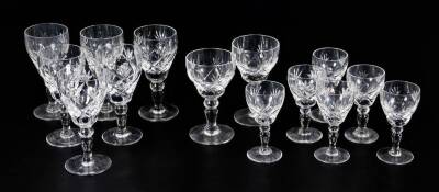 A harlequin suite of two sized crystal drinking glasses, each hobnail cut, on hour glass stems, some marked beneath, 12cm H, etc.