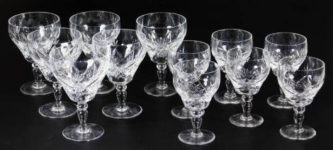 Six Brierley crystal drinking glasses, with shaped bowls, with a hobnail cut repeat decoration on shaped stems and circular feet, 14cm H and six further similar glasses of similar decoration. (a quantity)