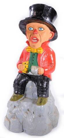 A hollow metal figure, of a gentleman in red jacket, with black top hat and black trousers, holding jug, 45cm H.